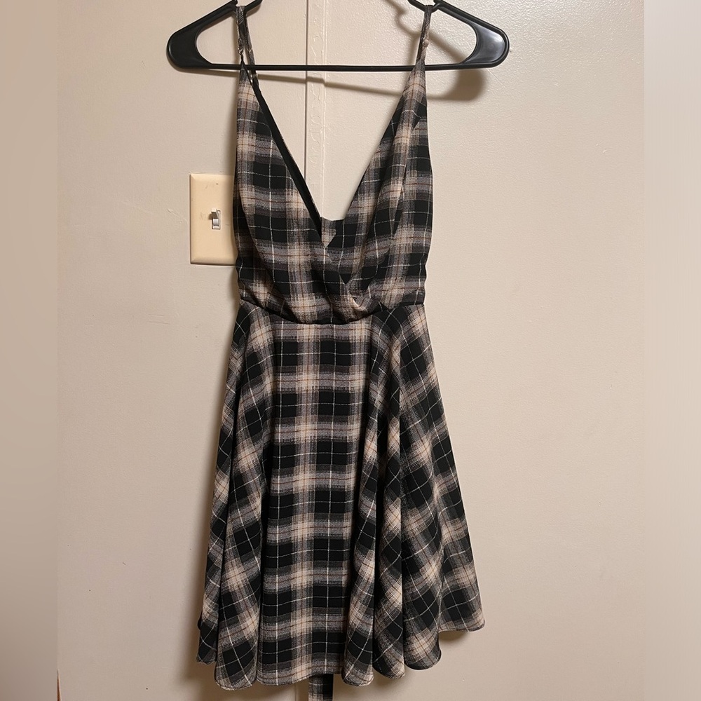 Essue black and brown plaid v-neck wrap mini dress.